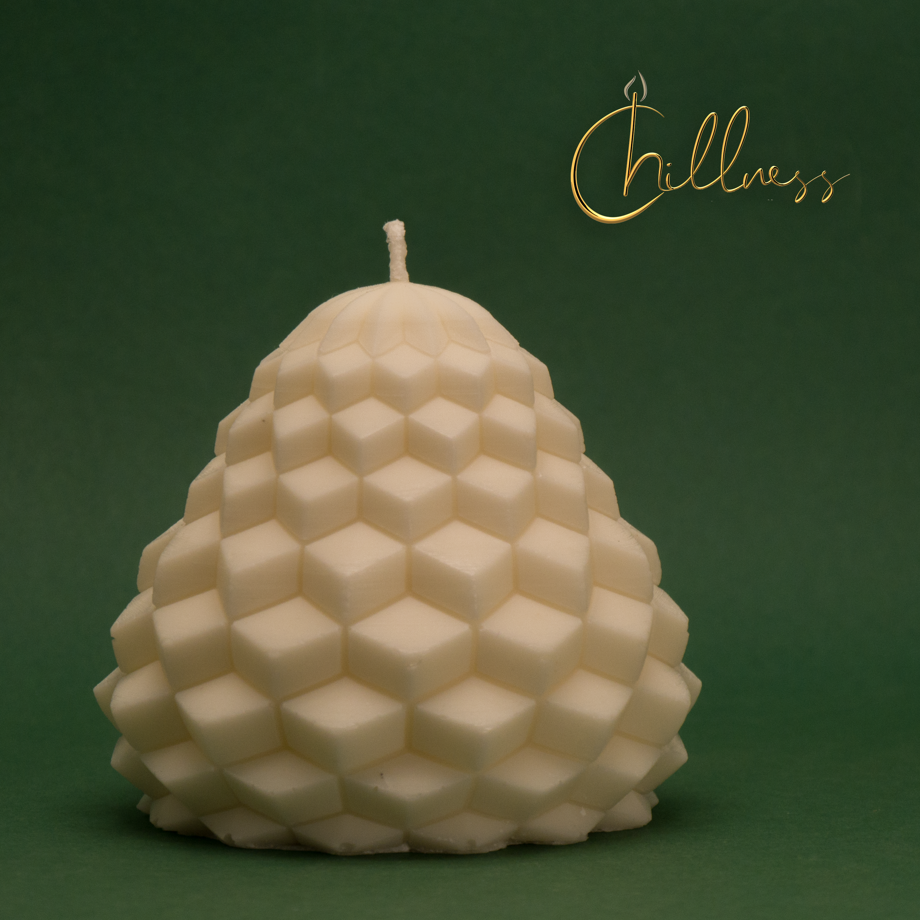 Chillness geometric cube-pattern pear candle on green background