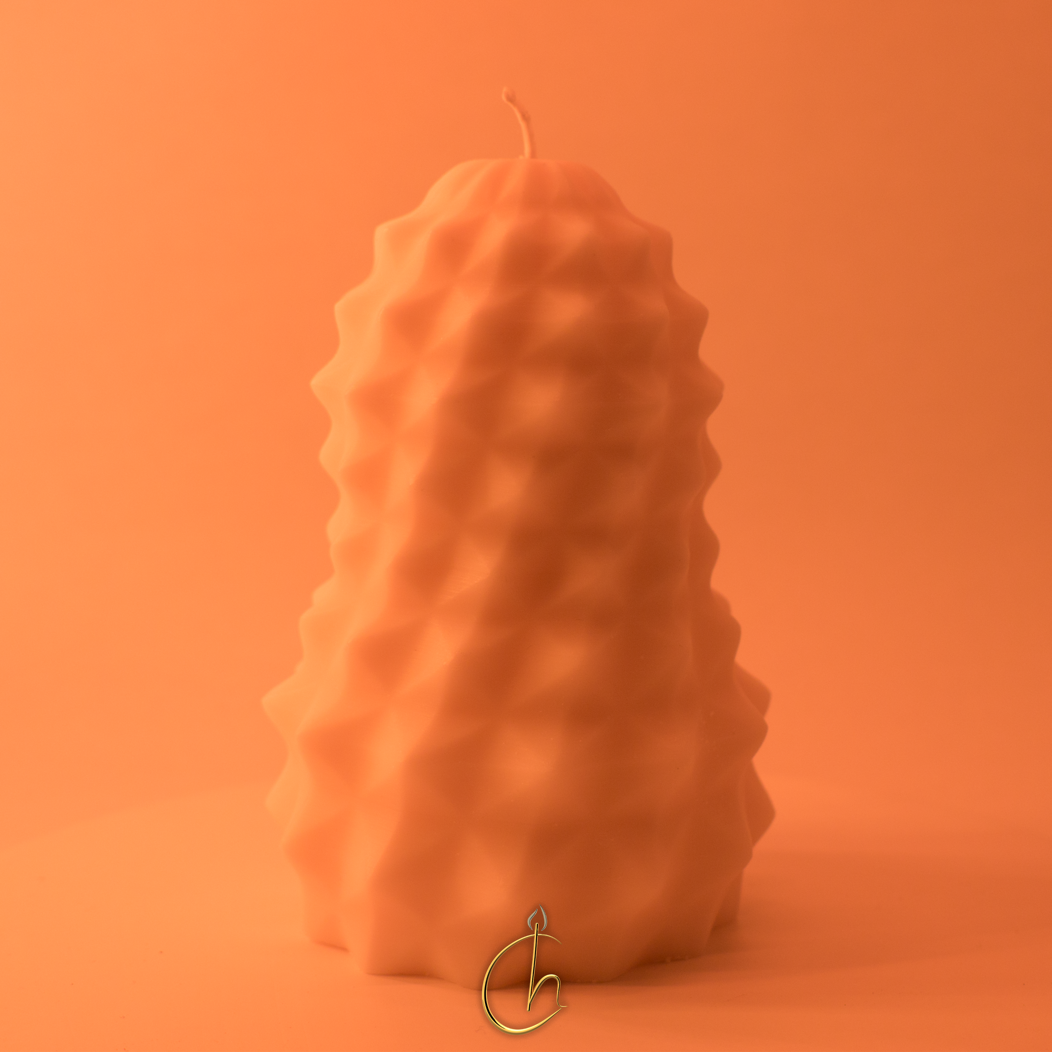 Chillness tall textured candle in orange on matching background