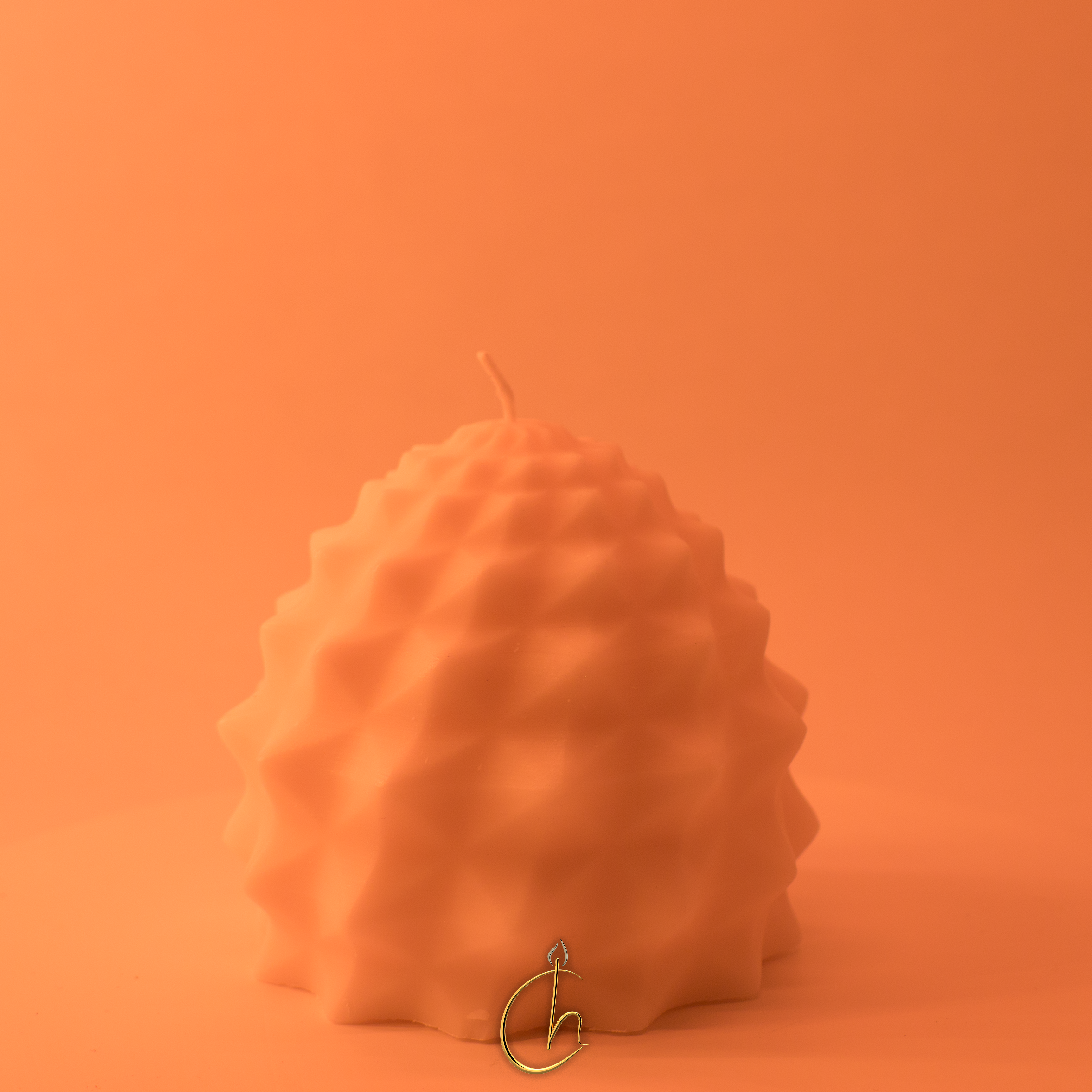 Chillness organic round candle in orange on matching background